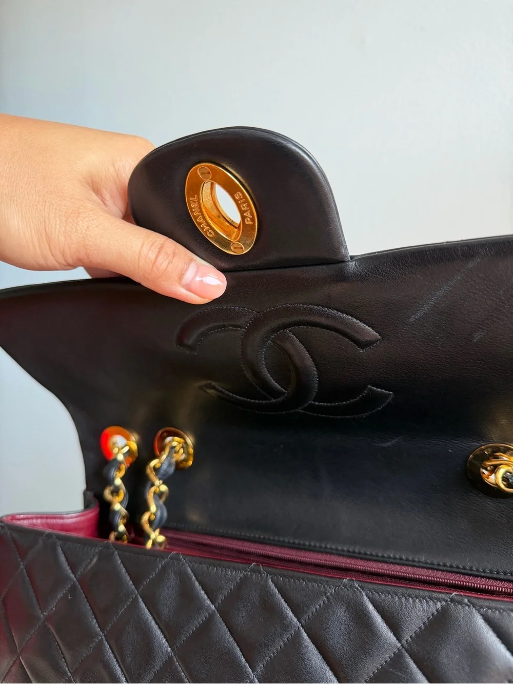 CHANEL Black Quilted Shoulder Bag with Gold Chain & CC Lock